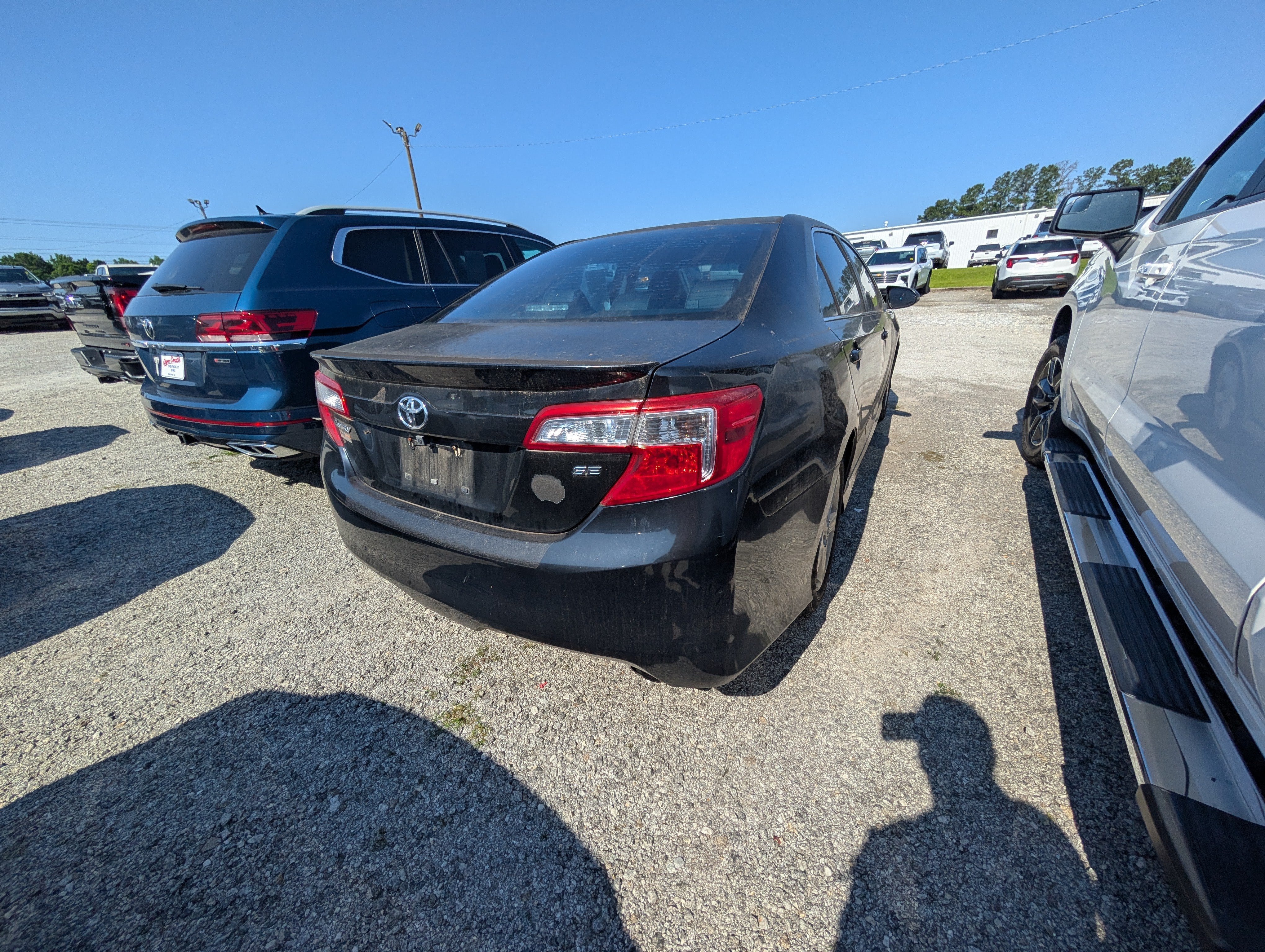 2013 Toyota Camry — rear three-quarter view